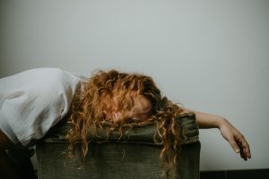 exhausted woman lying down