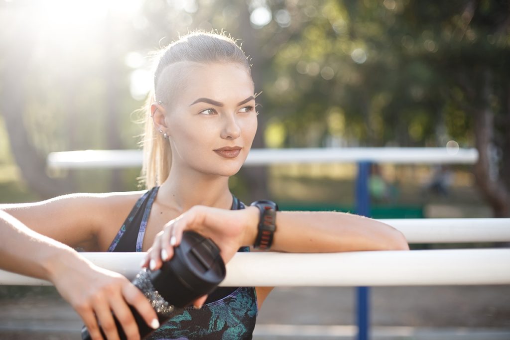 Young woman resting after workout